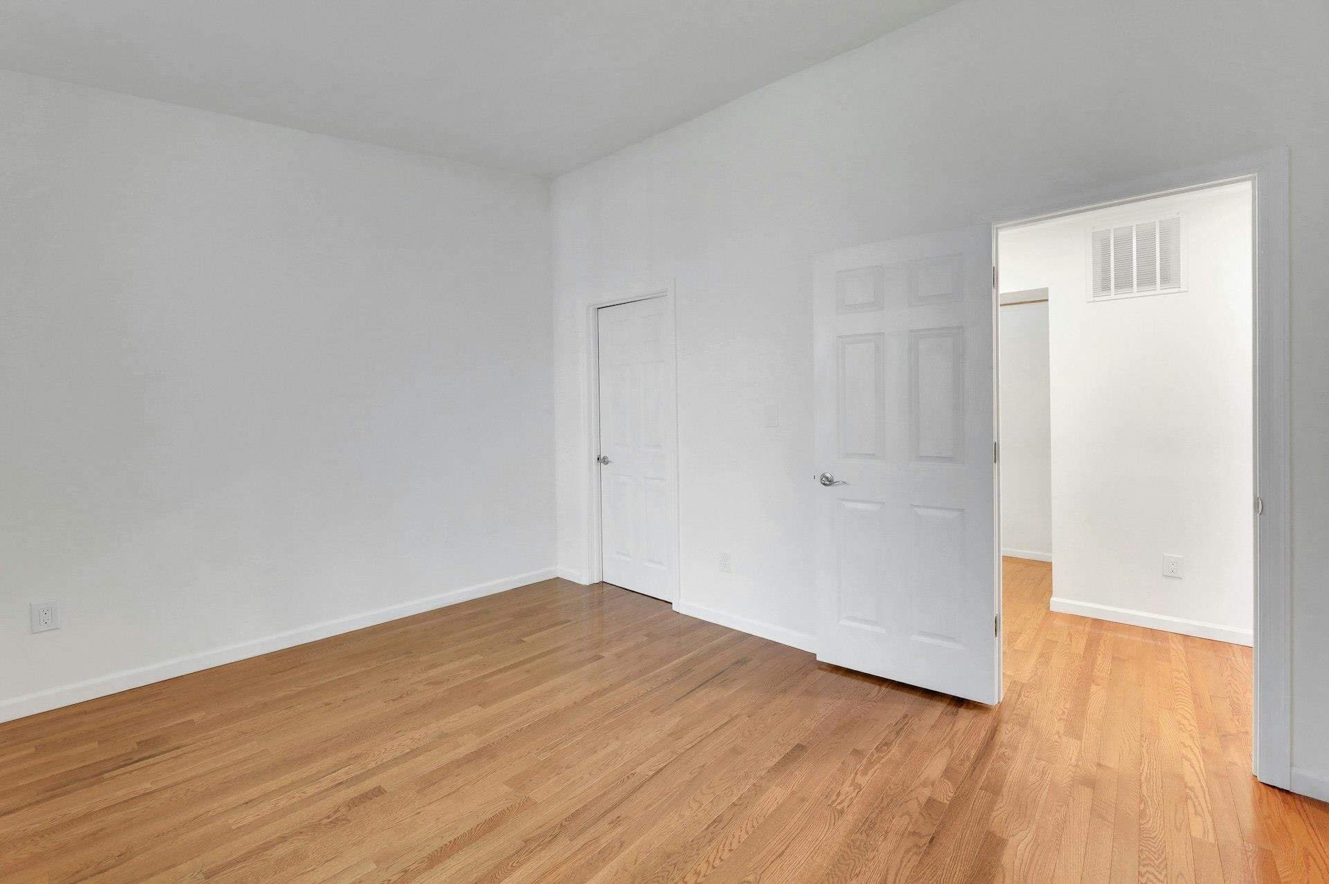 726 Mainsail Lane, Unit MAINSAIL LANE Secaucus, NJ 07094 - Photo 24 of 39 a view of empty room with wooden floor