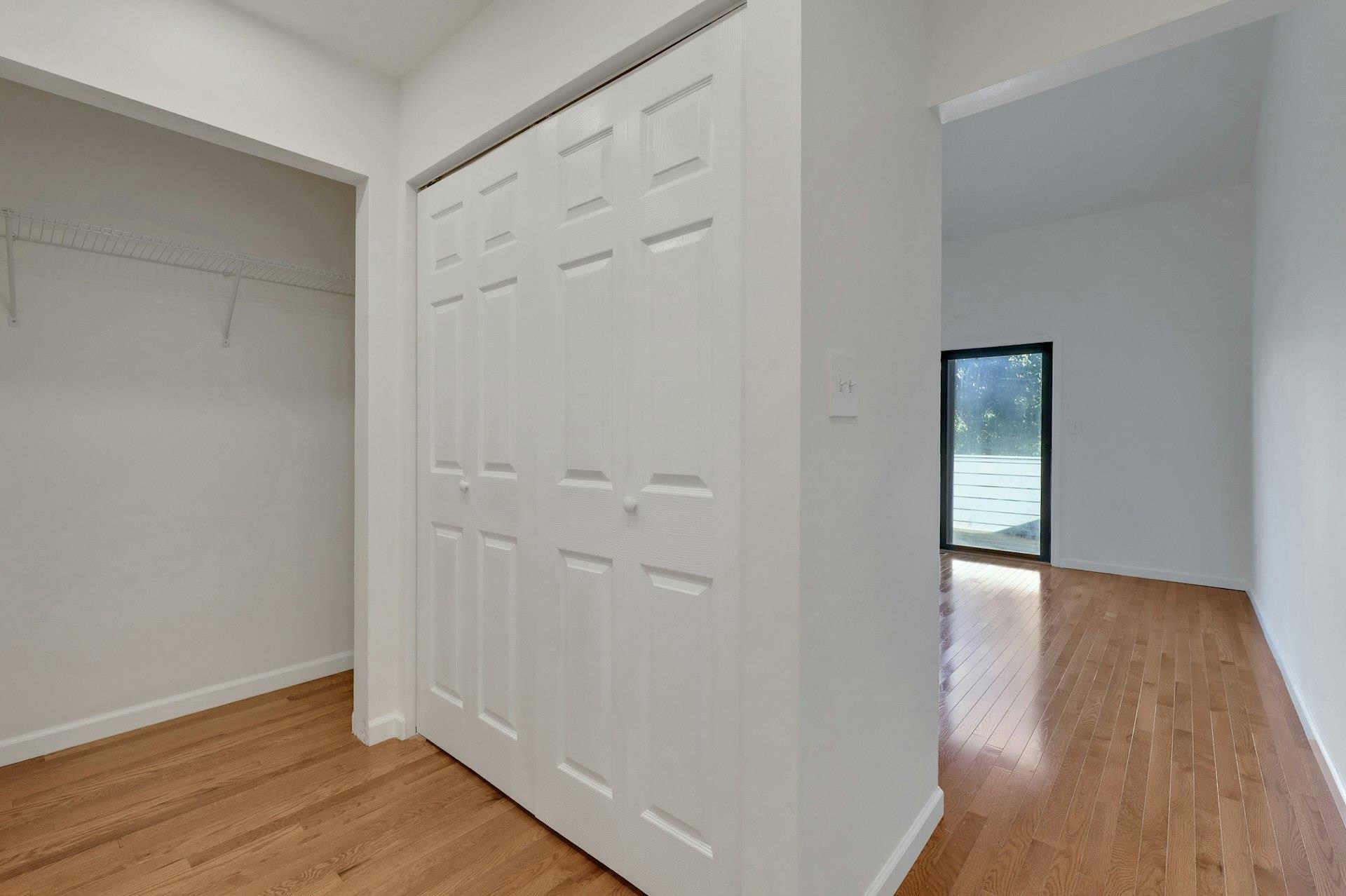 726 Mainsail Lane, Unit MAINSAIL LANE Secaucus, NJ 07094 - Photo 28 of 39 wooden floor with white walls