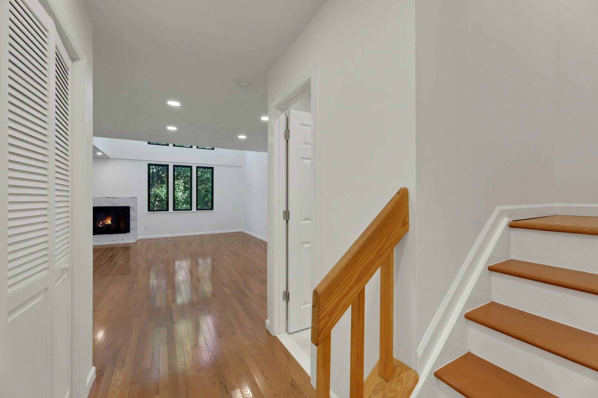 726 Mainsail Lane, Unit MAINSAIL LANE Secaucus, NJ 07094 - Photo 4 of 39 a view of a hallway with wooden floor and staircase