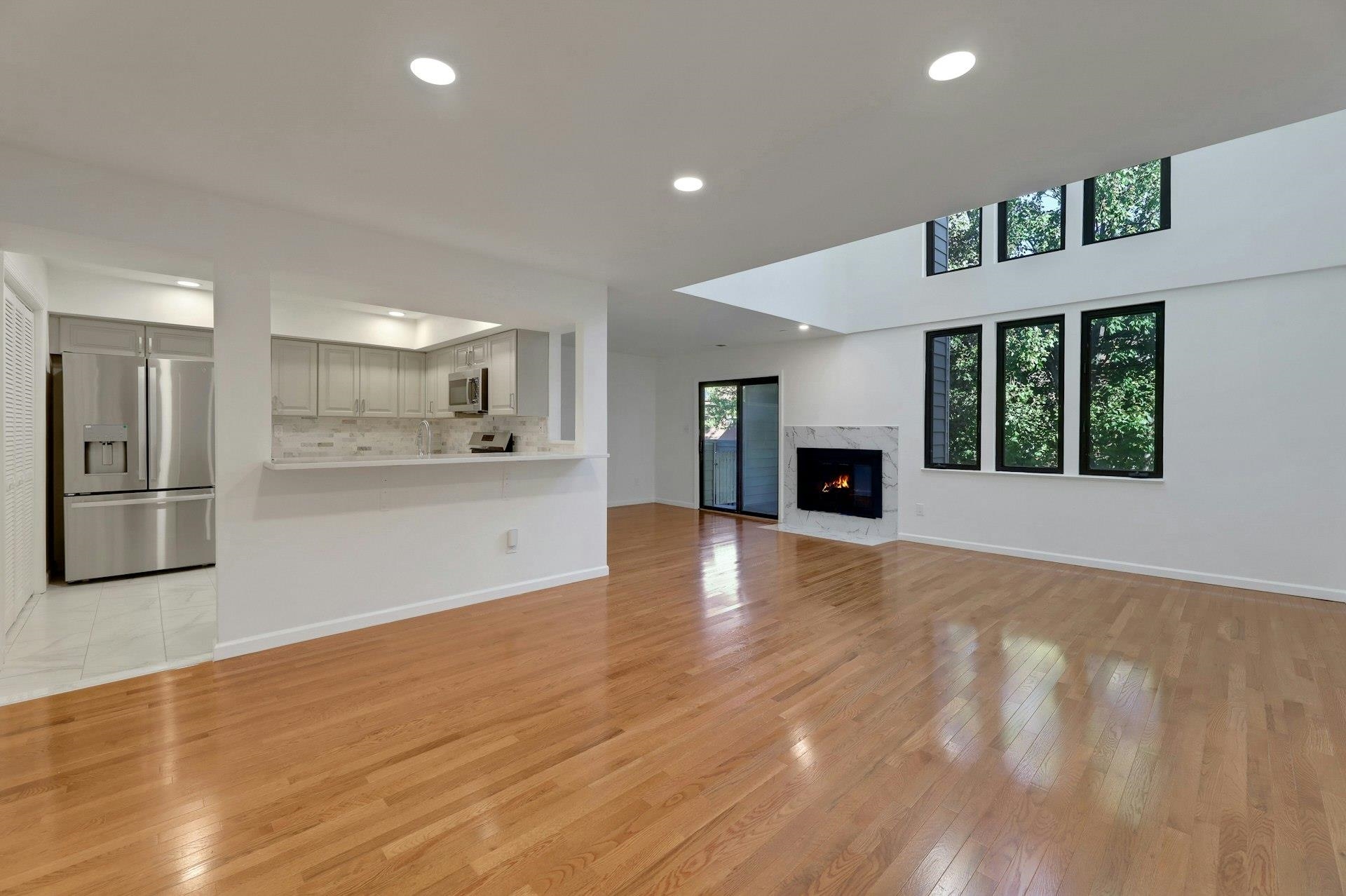 726 Mainsail Lane, Unit MAINSAIL LANE Secaucus, NJ 07094 - Photo 6 of 39 a view of an empty room with kitchen and a window