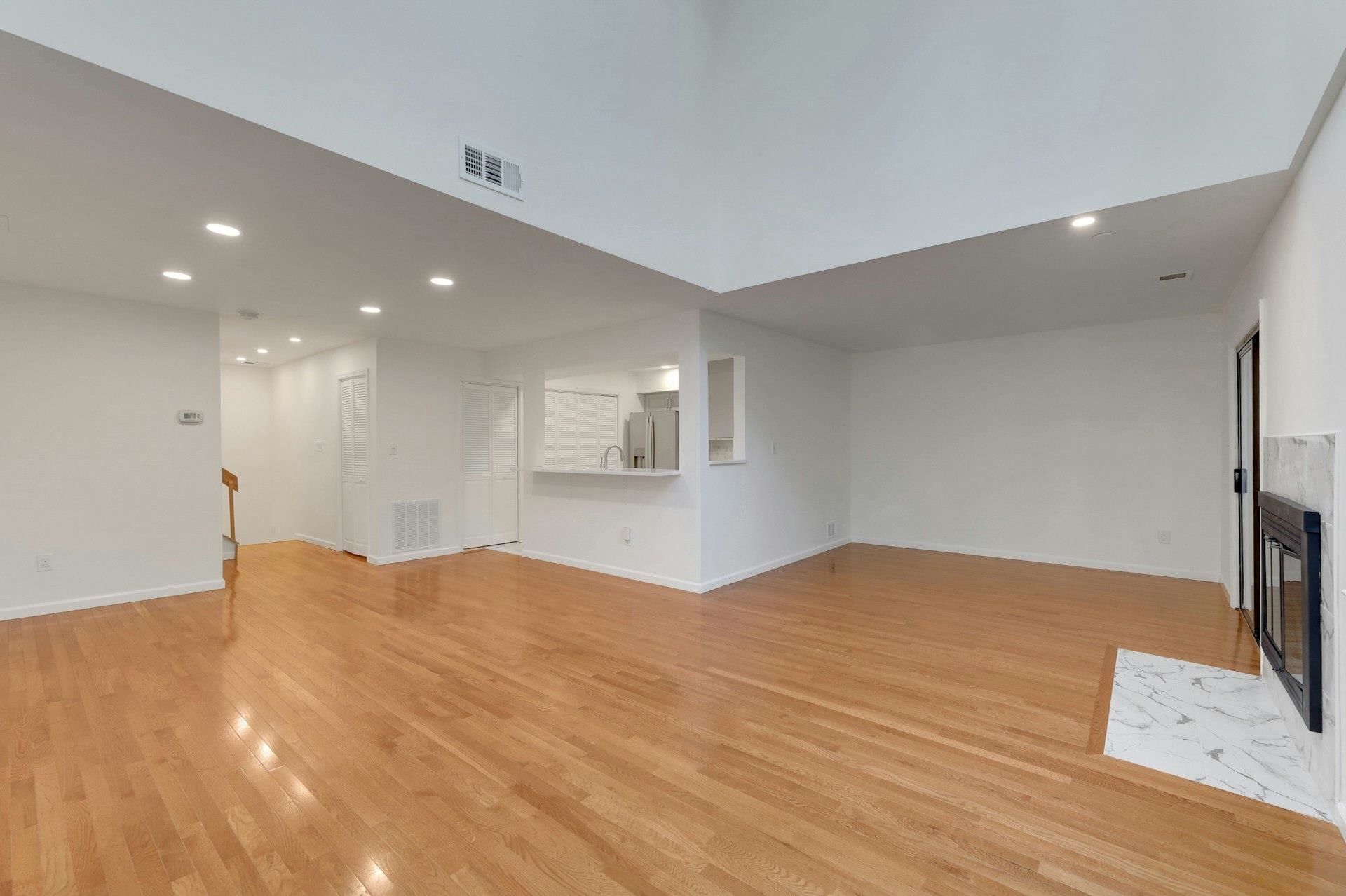 726 Mainsail Lane, Unit MAINSAIL LANE Secaucus, NJ 07094 - Photo 8 of 39 a view of an empty room with wooden floor and a window