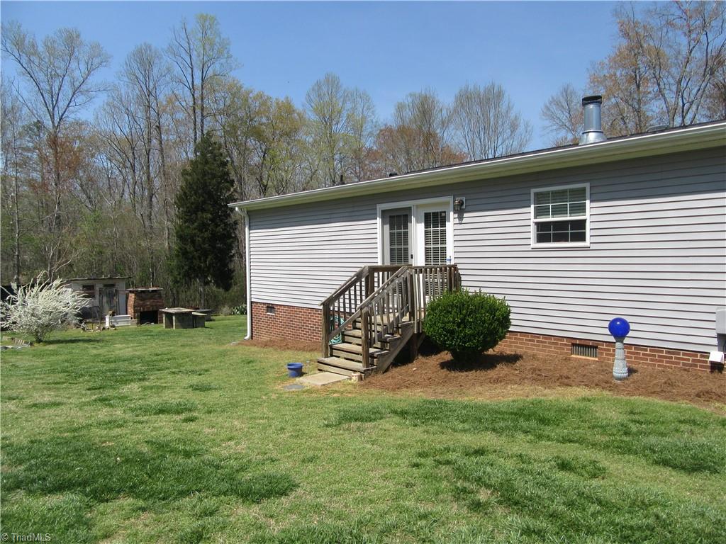3591 Grubbs Road Walkertown, NC 27051 - Photo 22 of 41 Rear view of home. You can see the concrete picnic table, fireplace and chicken house off to the left