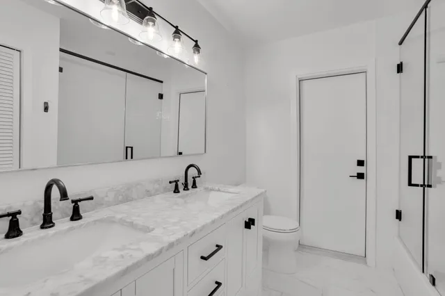 a view of a house with backyard sitting area and garden