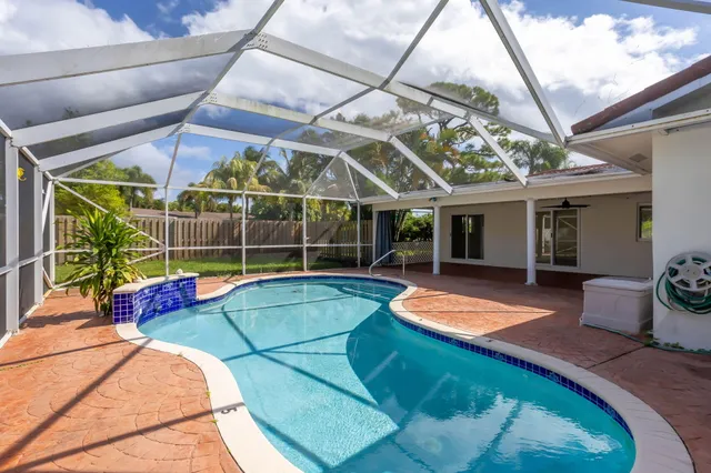 a view of swimming pool with a patio
