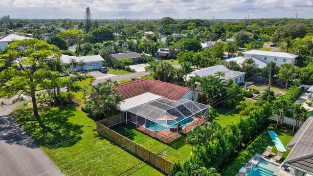 an aerial view of residential houses with outdoor space