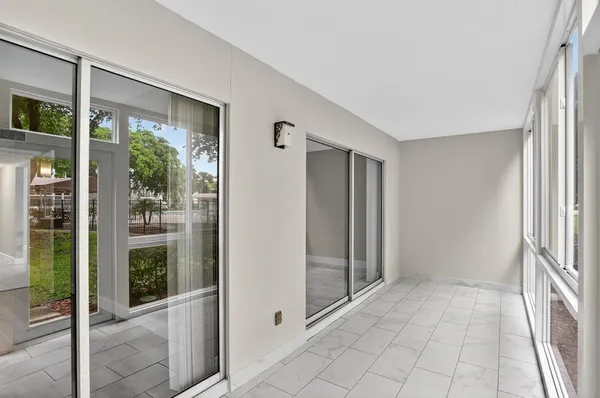 a view of a hallway with windows