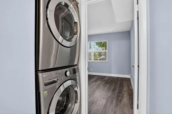a view of a storage and utility room with washer and dryer
