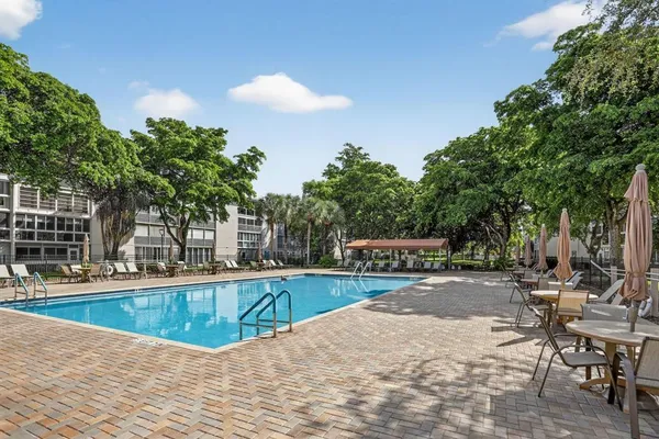 a view of a swimming pool with chairs