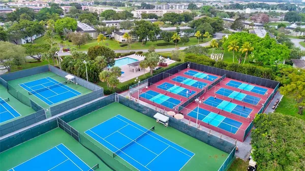 a view of a tennis ground with a mountain view