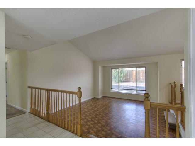 2801 Bridgeport Avenue San Ramon, CA 94583 - Photo 7 of 16 a view of an empty room with wooden floor and a window