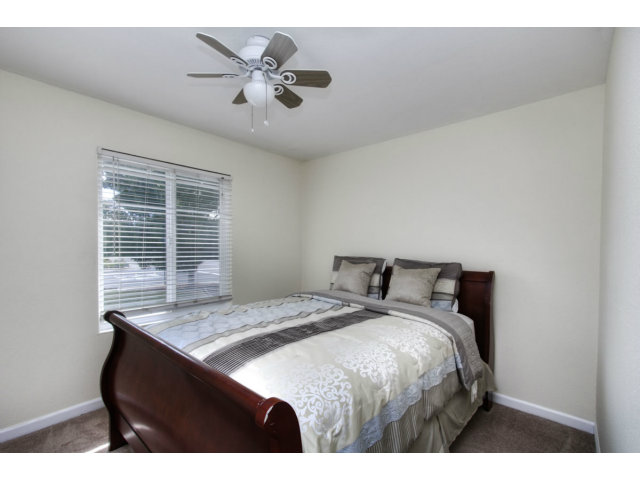 2801 Bridgeport Avenue San Ramon, CA 94583 - Photo 9 of 16 a bed sitting in a bedroom next to a window