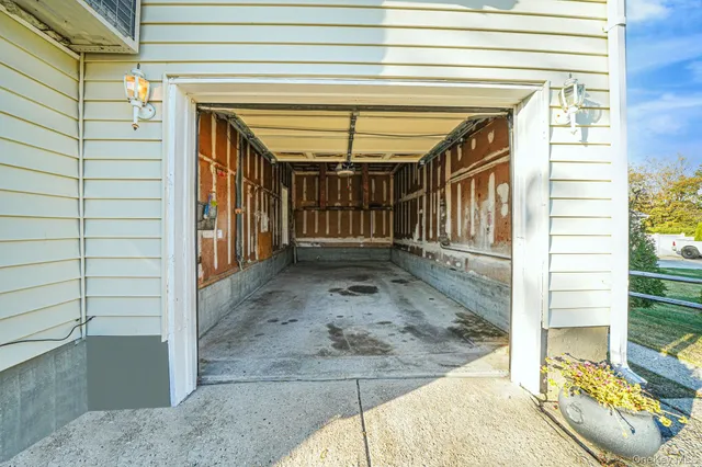 a patio with wooden floor a yard a table and chairs
