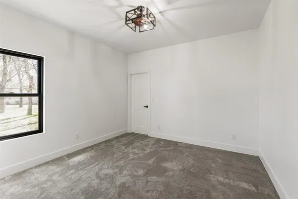 a view of room with wooden floor and closet