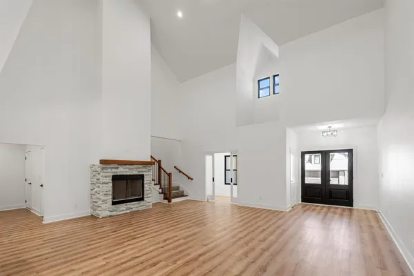 a kitchen with kitchen island white cabinets and white appliances