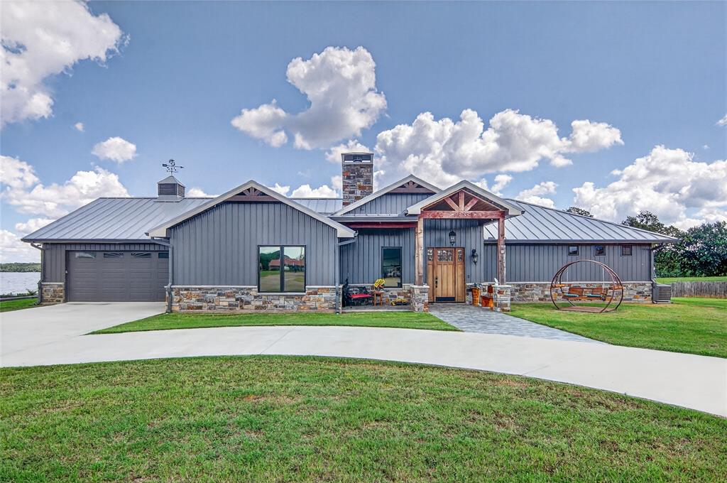 3016 W Highway Quitman, TX 75783 - Photo 1 of 40 a front view of a house with a yard and garage