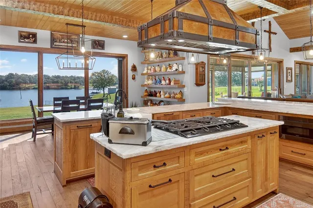 a stove top oven sitting inside of a kitchen