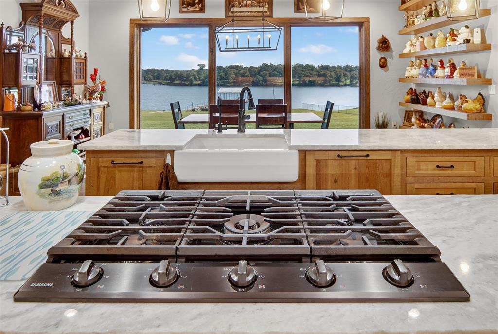 3016 W Highway Quitman, TX 75783 - Photo 12 of 40 a stove top oven sitting inside of a kitchen