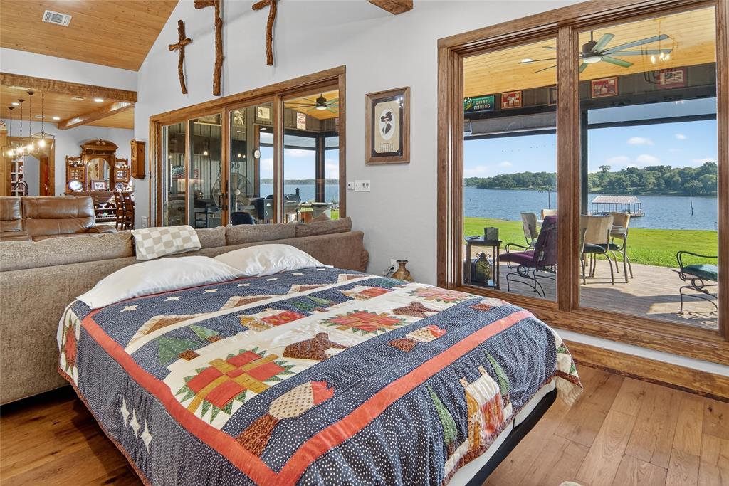 3016 W Highway Quitman, TX 75783 - Photo 24 of 40 a bed sitting in a bedroom next to a large window