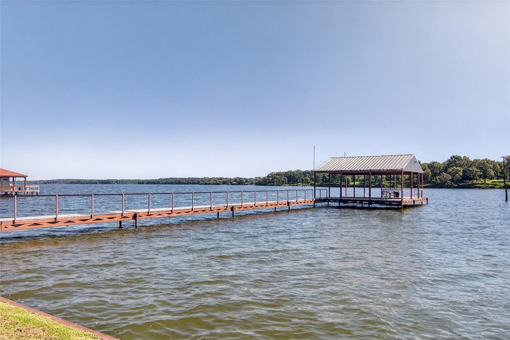 3016 W Highway Quitman, TX 75783 - Photo 33 of 40 a view of a lake with houses in the background
