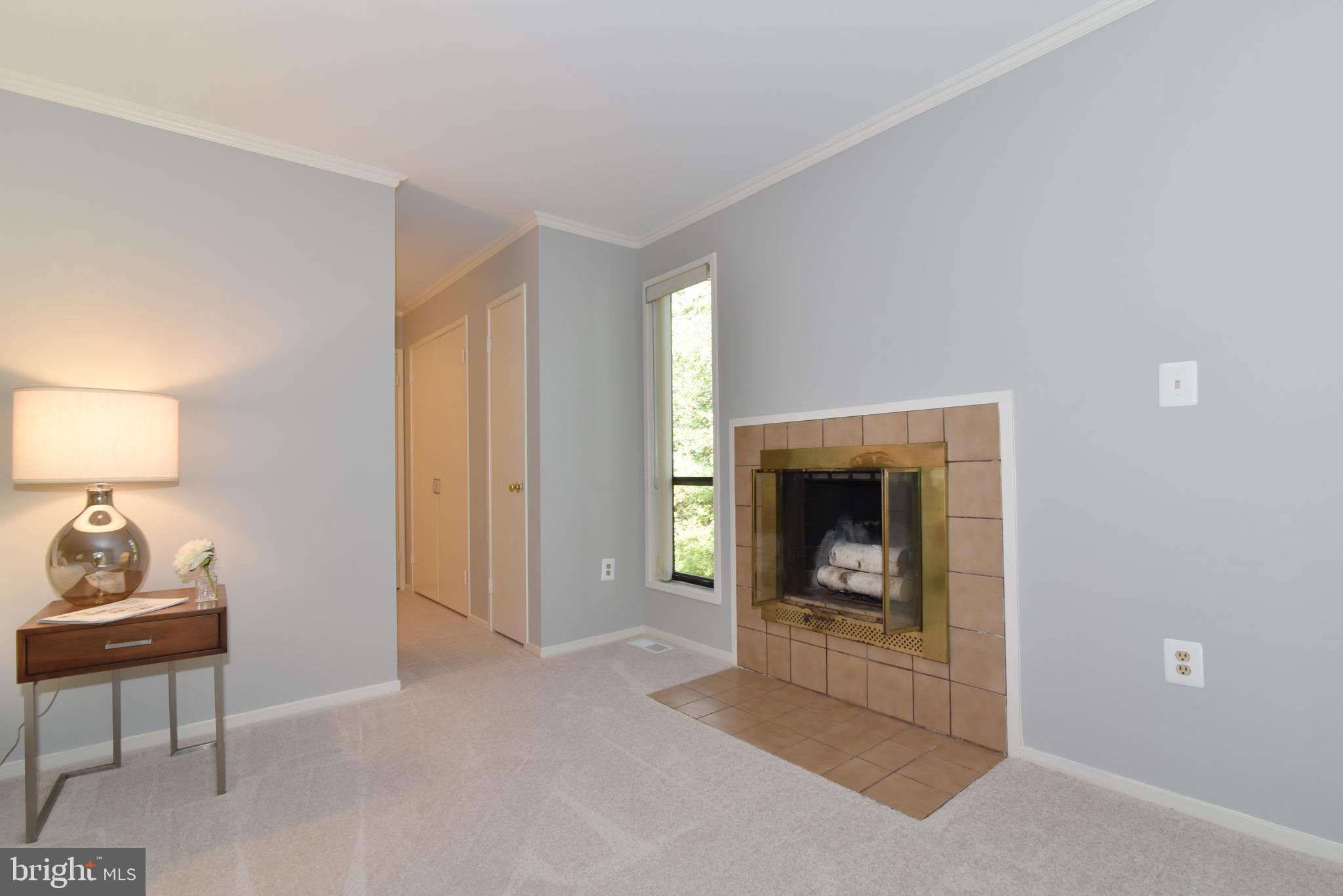 11117 Glade Drive Reston, VA 20191 - Photo 41 of 75 Primary suite with wood-burning fireplace.