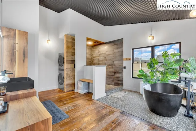 a kitchen with a wooden floor and a sink