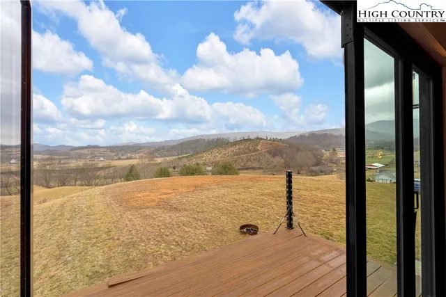 a bedroom with a large bed and a large window
