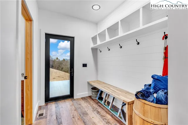 a living room with furniture and a ceiling fan