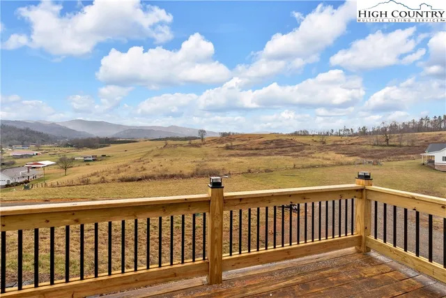 a bathroom with a granite countertop sink a shower and a mirror