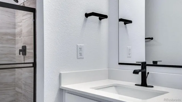 a bathroom with double vanity sink
