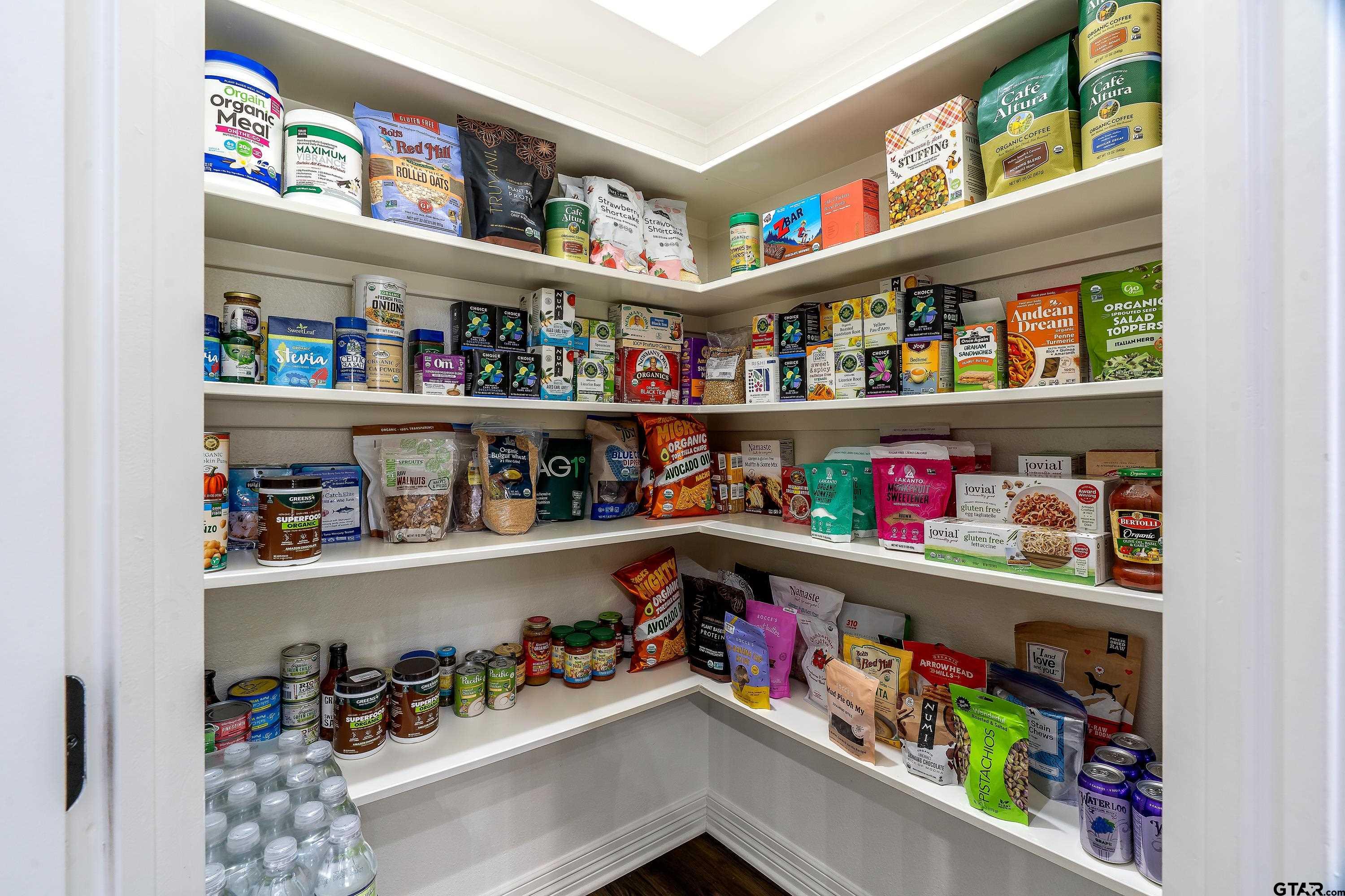 8199 Cr 314 Street South Laneville, TX 75667 - Photo 14 of 47 a room with lots of books and a refrigerator