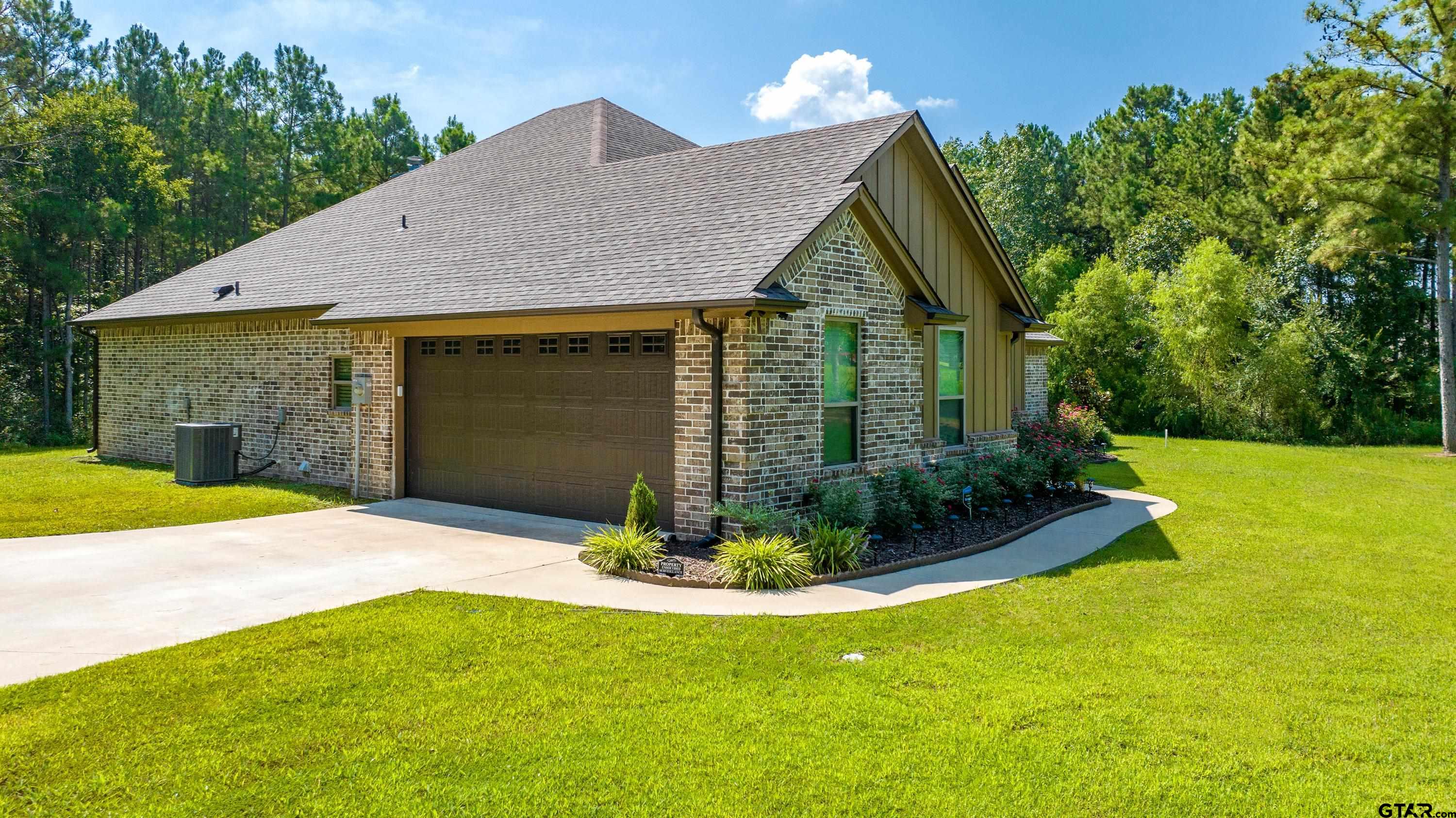8199 Cr 314 Street South Laneville, TX 75667 - Photo 35 of 47 a front view of a house with a yard