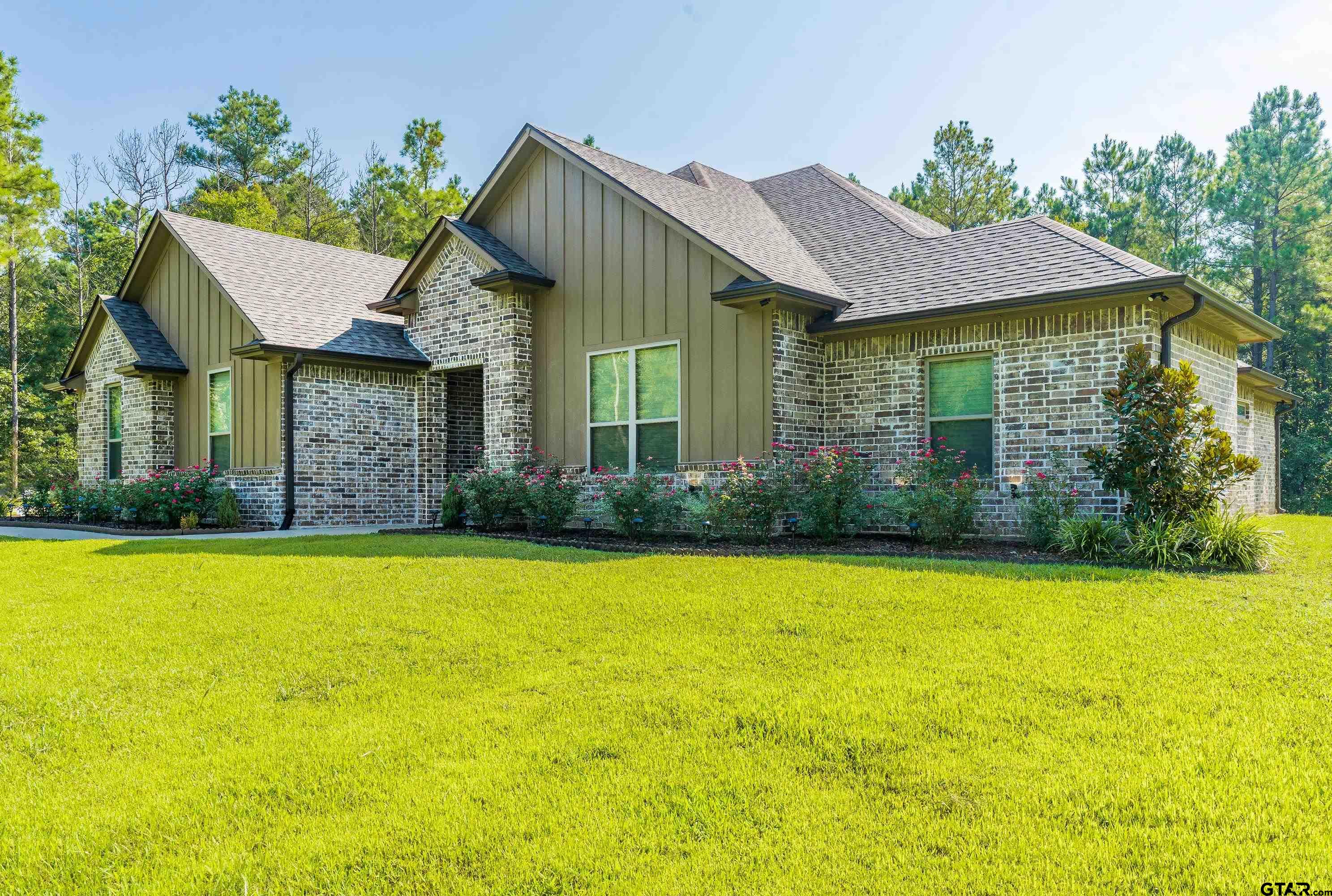 8199 Cr 314 Street South Laneville, TX 75667 - Photo 36 of 47 a front view of a house with a yard