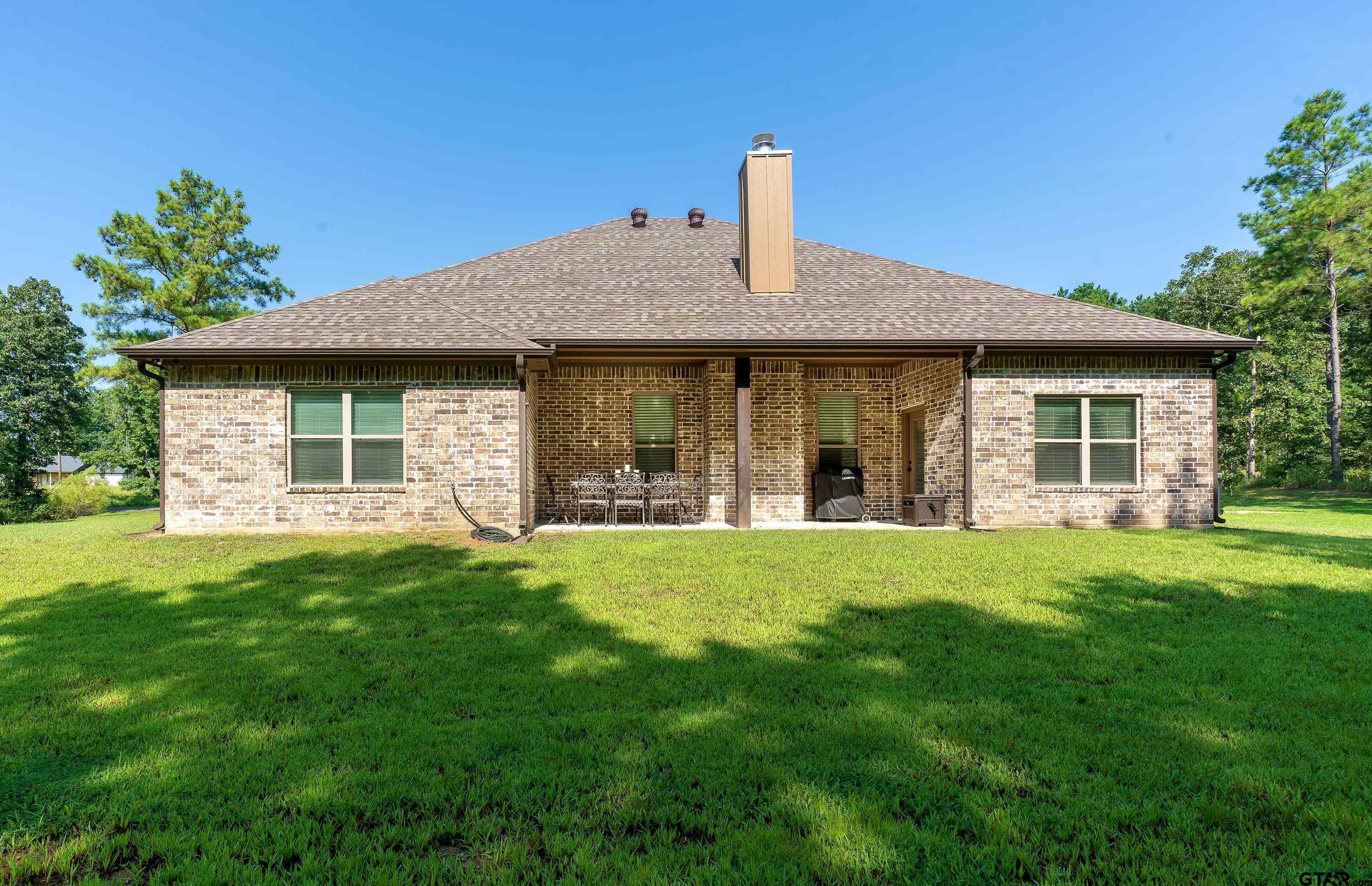 8199 Cr 314 Street South Laneville, TX 75667 - Photo 40 of 47 a front view of a house with a garden