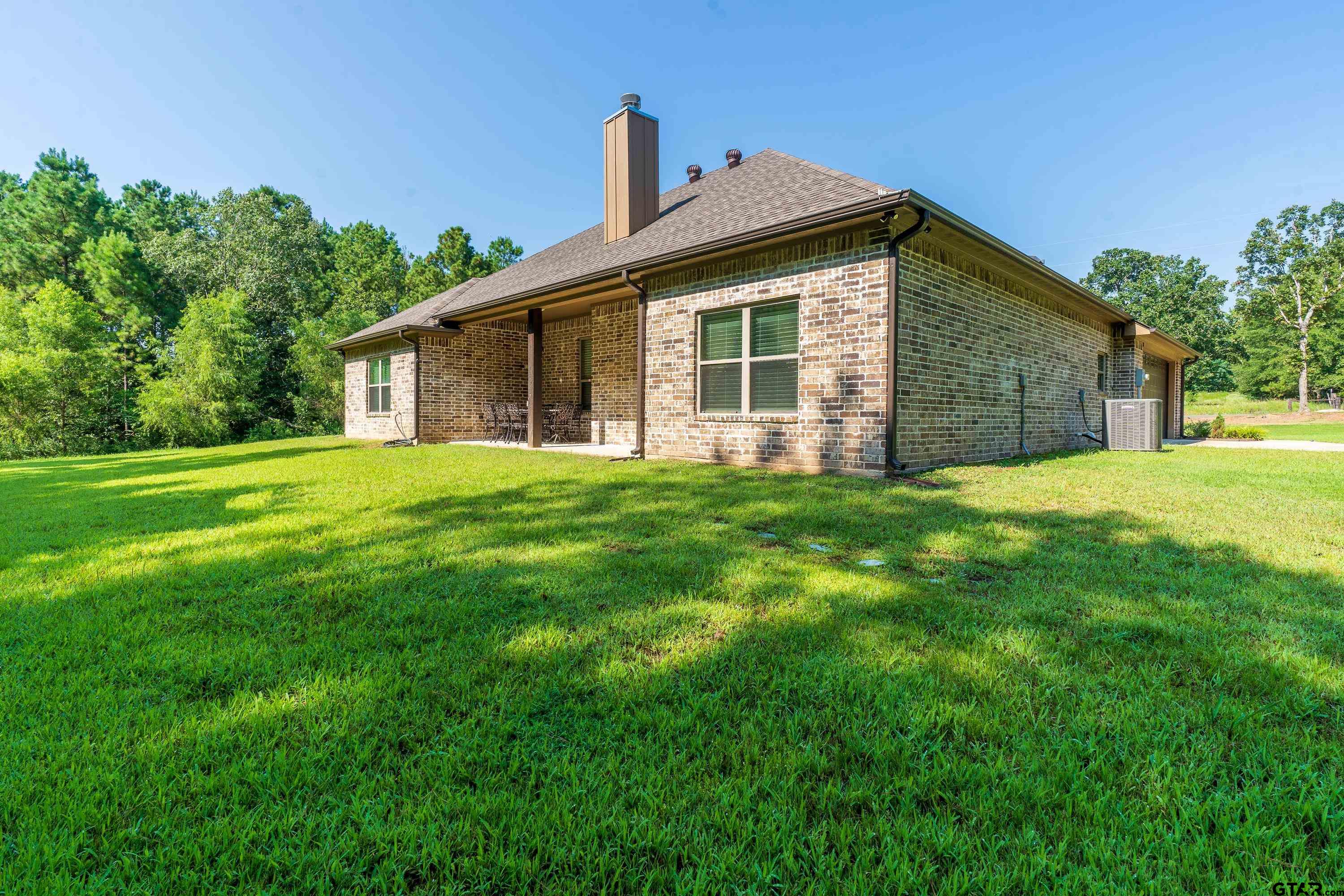 8199 Cr 314 Street South Laneville, TX 75667 - Photo 41 of 47 a front view of house with yard and green space