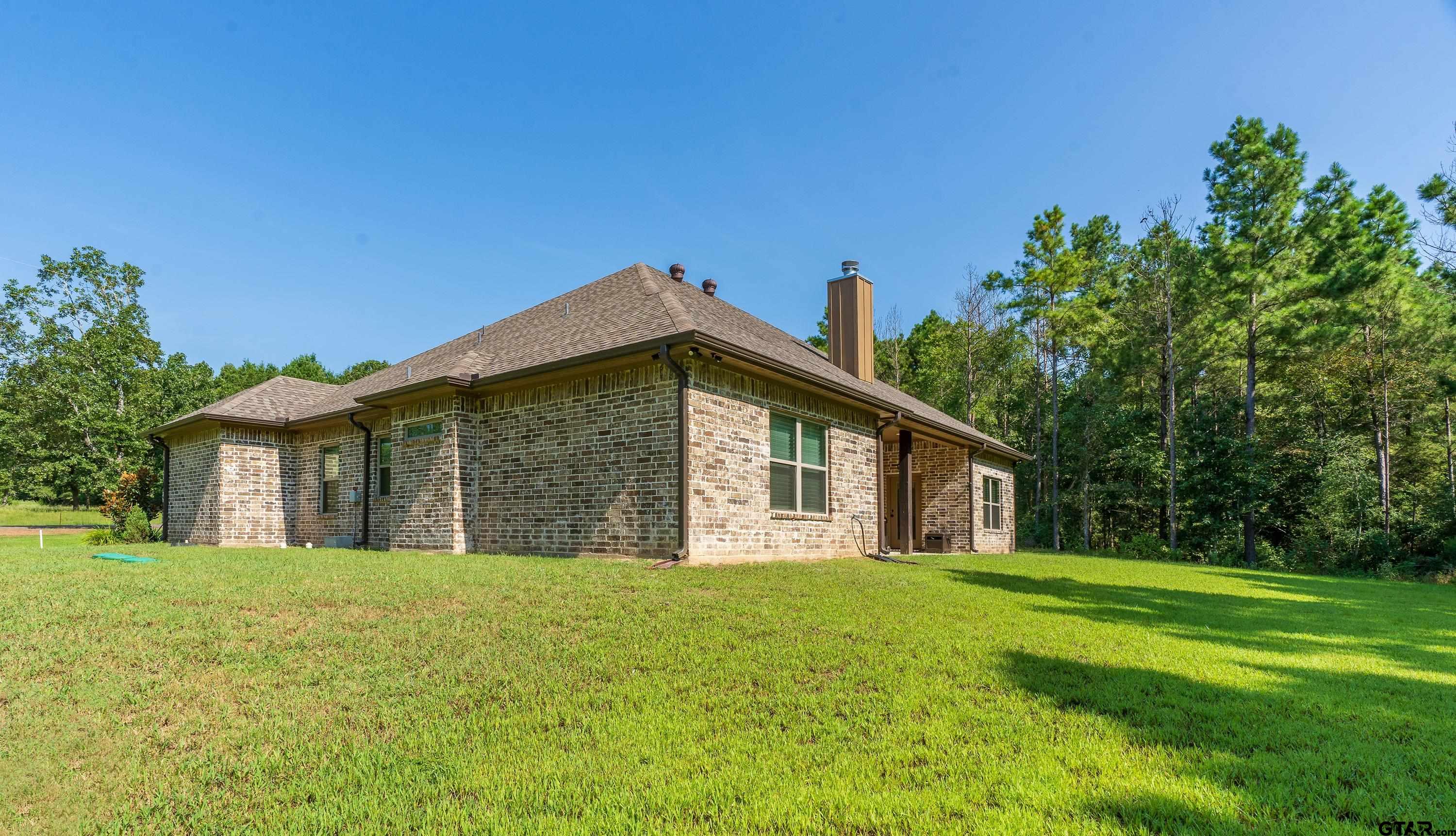 8199 Cr 314 Street South Laneville, TX 75667 - Photo 42 of 47 a view of a house with a yard