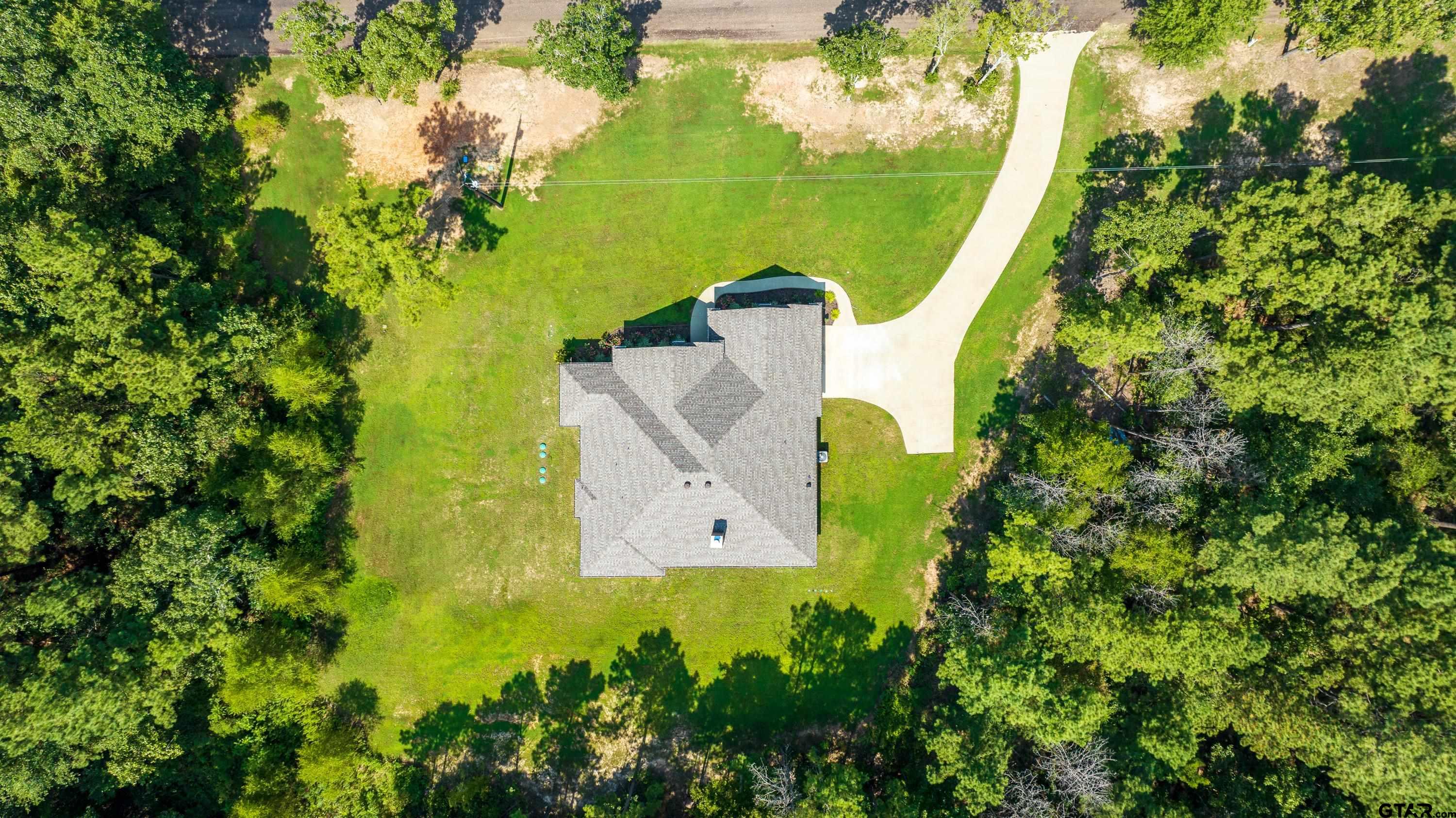 8199 Cr 314 Street South Laneville, TX 75667 - Photo 46 of 47 an aerial view of a house with a yard and garden