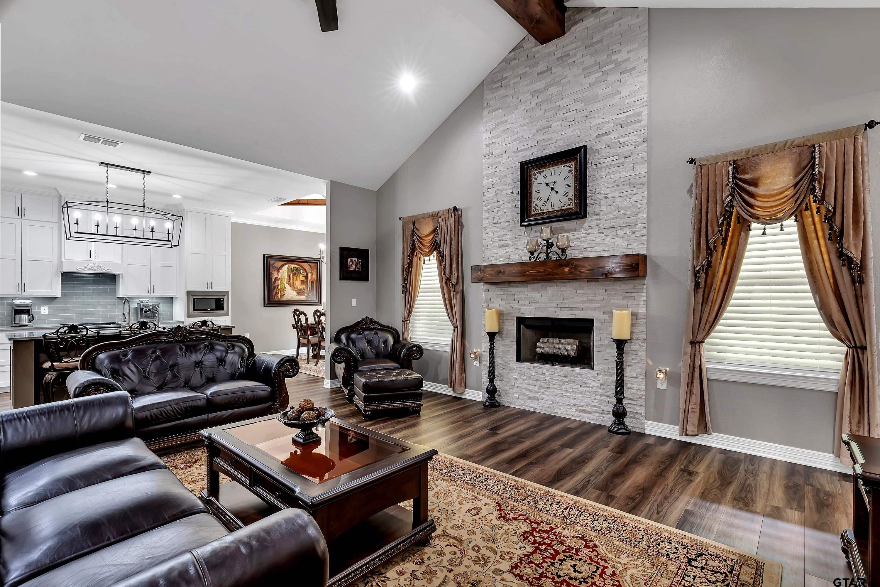 8199 Cr 314 Street South Laneville, TX 75667 - Photo 5 of 47 a living room with furniture and a fireplace