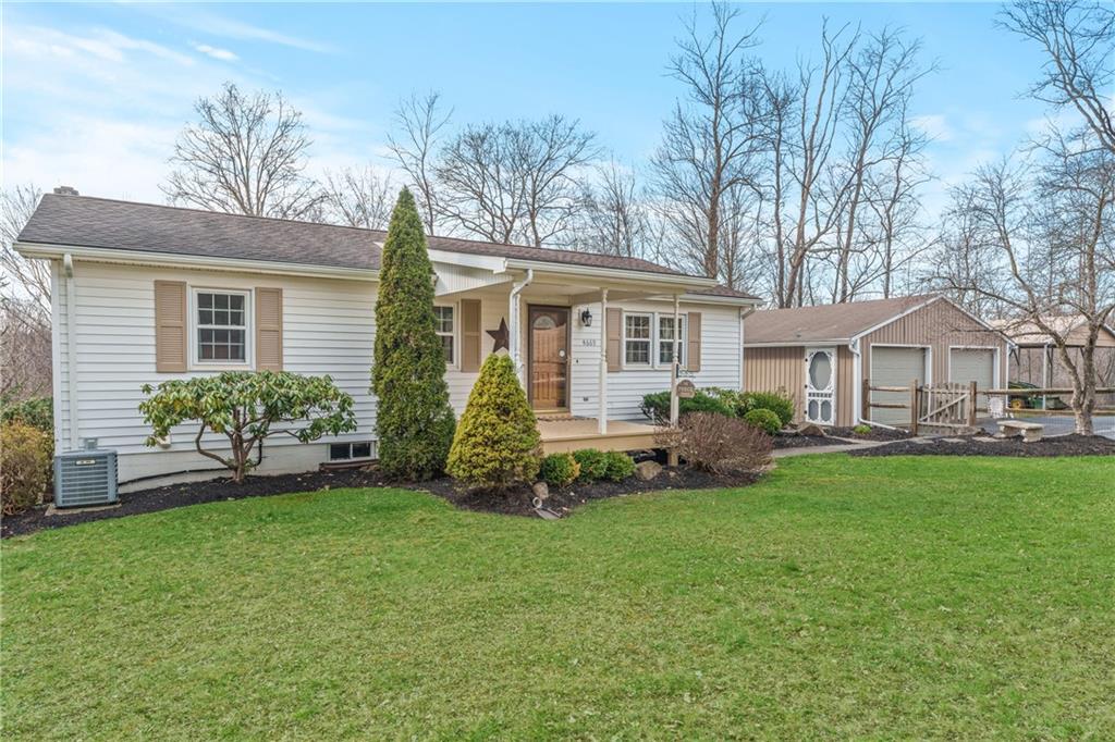 4689 Bell Road Cochranton, PA 16314 - Photo 1 of 32 a front view of a house with a garden and yard