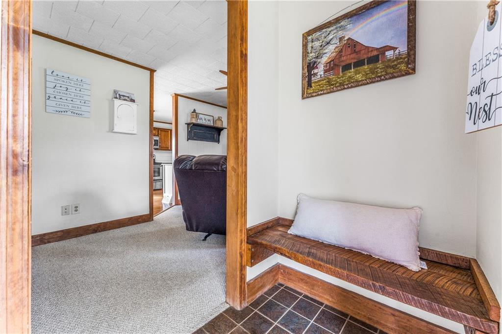 4689 Bell Road Cochranton, PA 16314 - Photo 4 of 32 a view of an empty room with painting on the wall