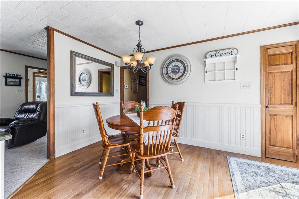 4689 Bell Road Cochranton, PA 16314 - Photo 9 of 32 a view of a dining room with furniture and wooden floor