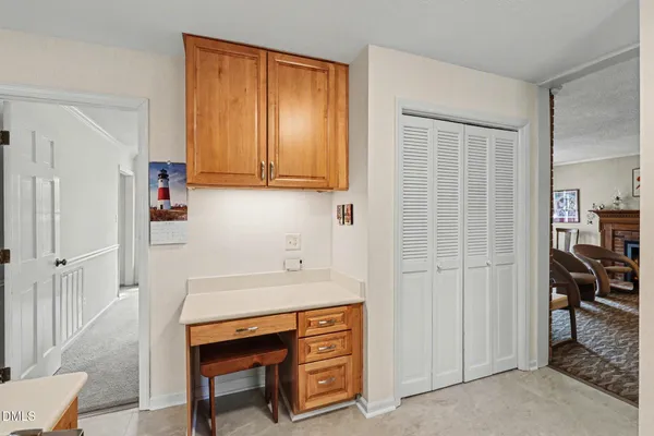 a room that has a dresser and a window in it