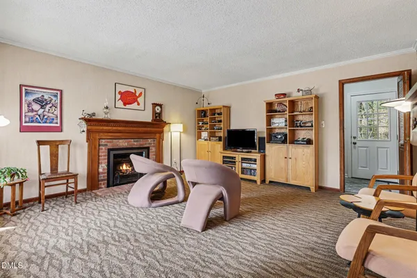 a bedroom with furniture and a fireplace