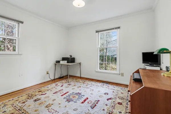 a bedroom with bed and a window