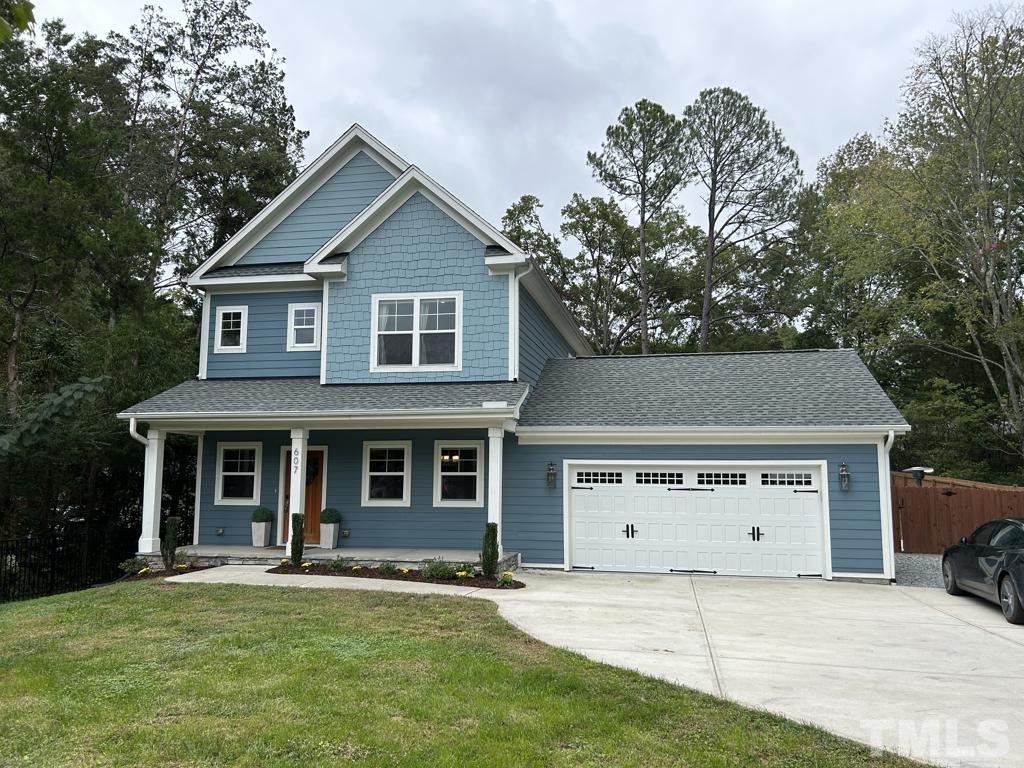 607 Morreene Road Durham, NC 27705 - Photo 1 of 48 front view of a house with a yard