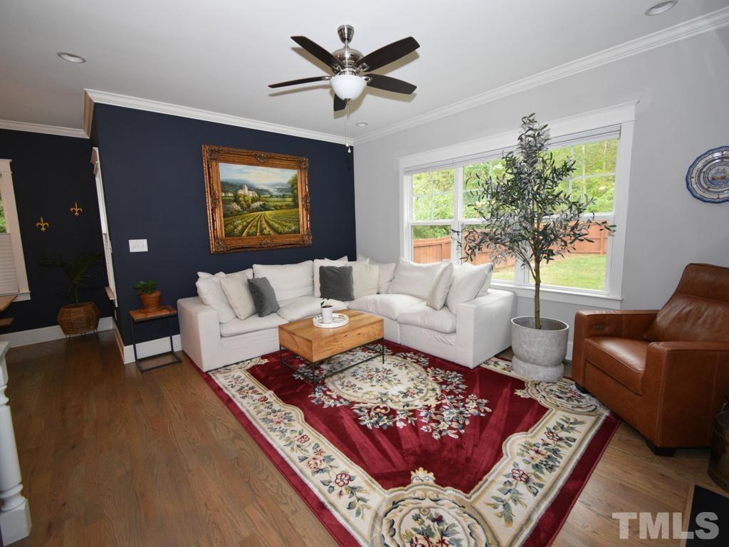 607 Morreene Road Durham, NC 27705 - Photo 17 of 48 a living room with furniture rug and window