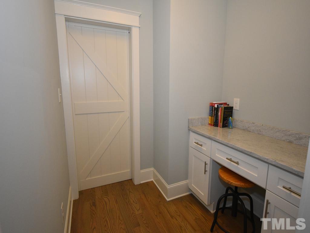 607 Morreene Road Durham, NC 27705 - Photo 18 of 48 a room with a table and chairs