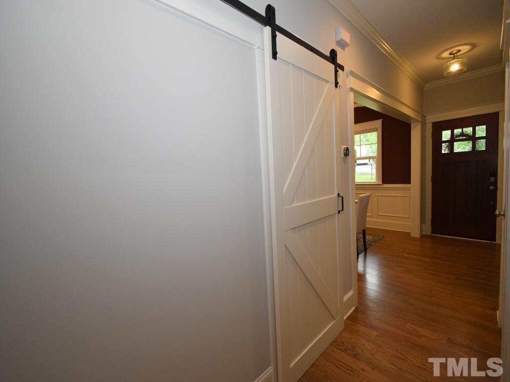 607 Morreene Road Durham, NC 27705 - Photo 20 of 48 a view of entryway with wooden floor and stairs