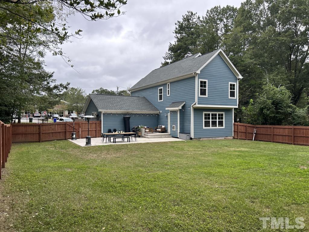 607 Morreene Road Durham, NC 27705 - Photo 2 of 48 a front view of house with yard and trees in the background