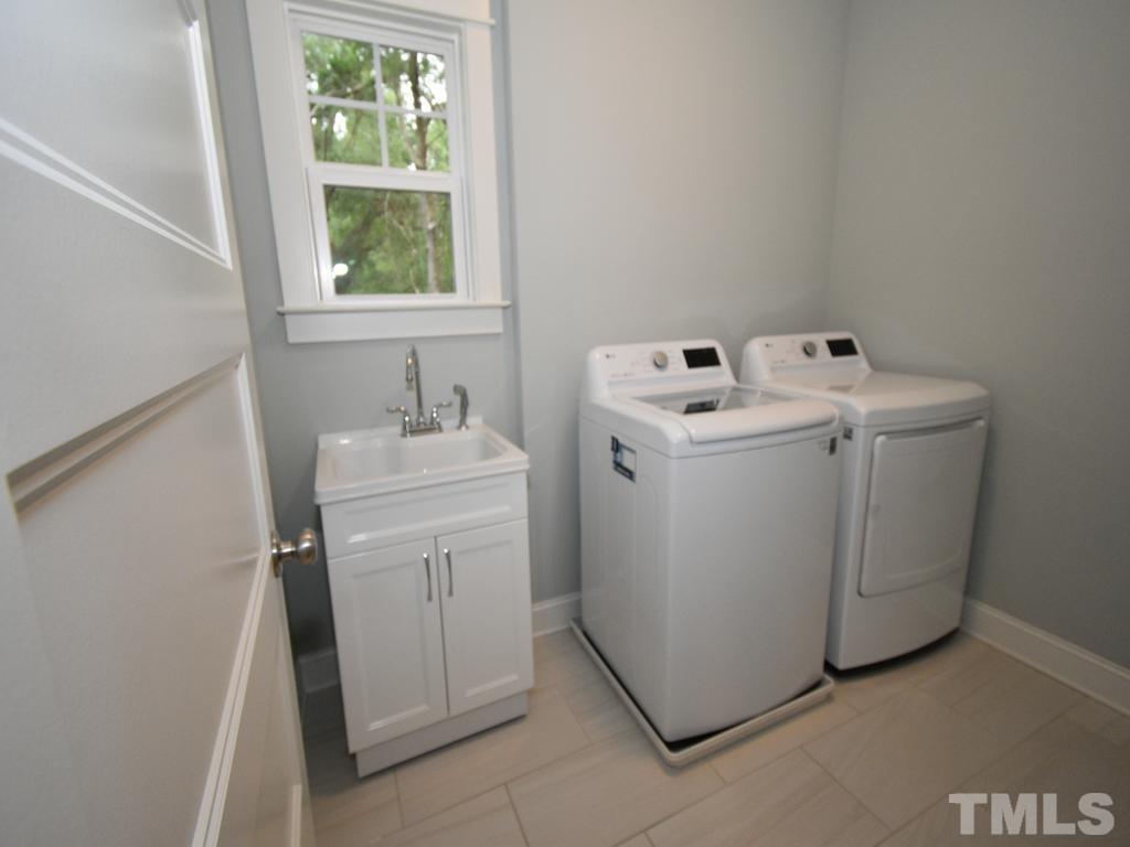 607 Morreene Road Durham, NC 27705 - Photo 26 of 48 a utility room with dryer and washer