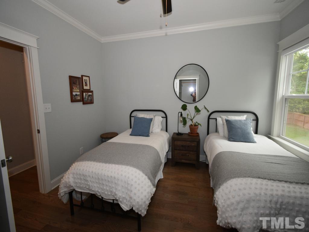 607 Morreene Road Durham, NC 27705 - Photo 28 of 48 a bedroom with bed and a window